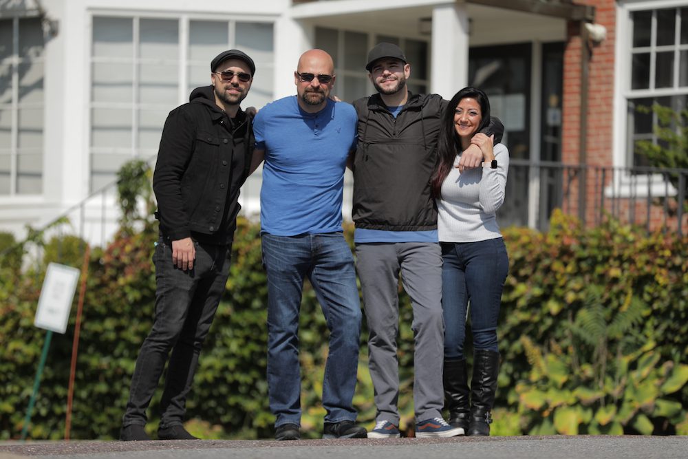 Dave Tango, Jason Hawes, Steve Gonsalves, and Shari DeBenedetti stand infront of Brick and Ash.